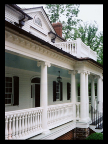 New residence with custom front porch with ionic columns, wood balustrade and copper gutters for house at the Greenbrier, West Virginia, designed by Candace M.P. Smith Architect